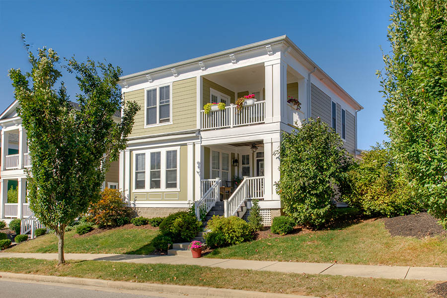 Exterior view of apartment with second-floor balcony